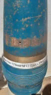 175mm Howitzer round with charge bag and container.
